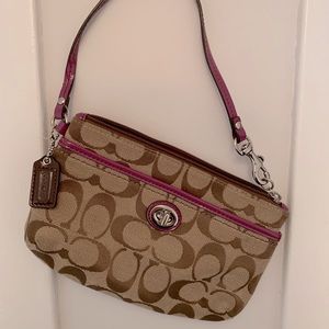 Coach wristlet with pink accents